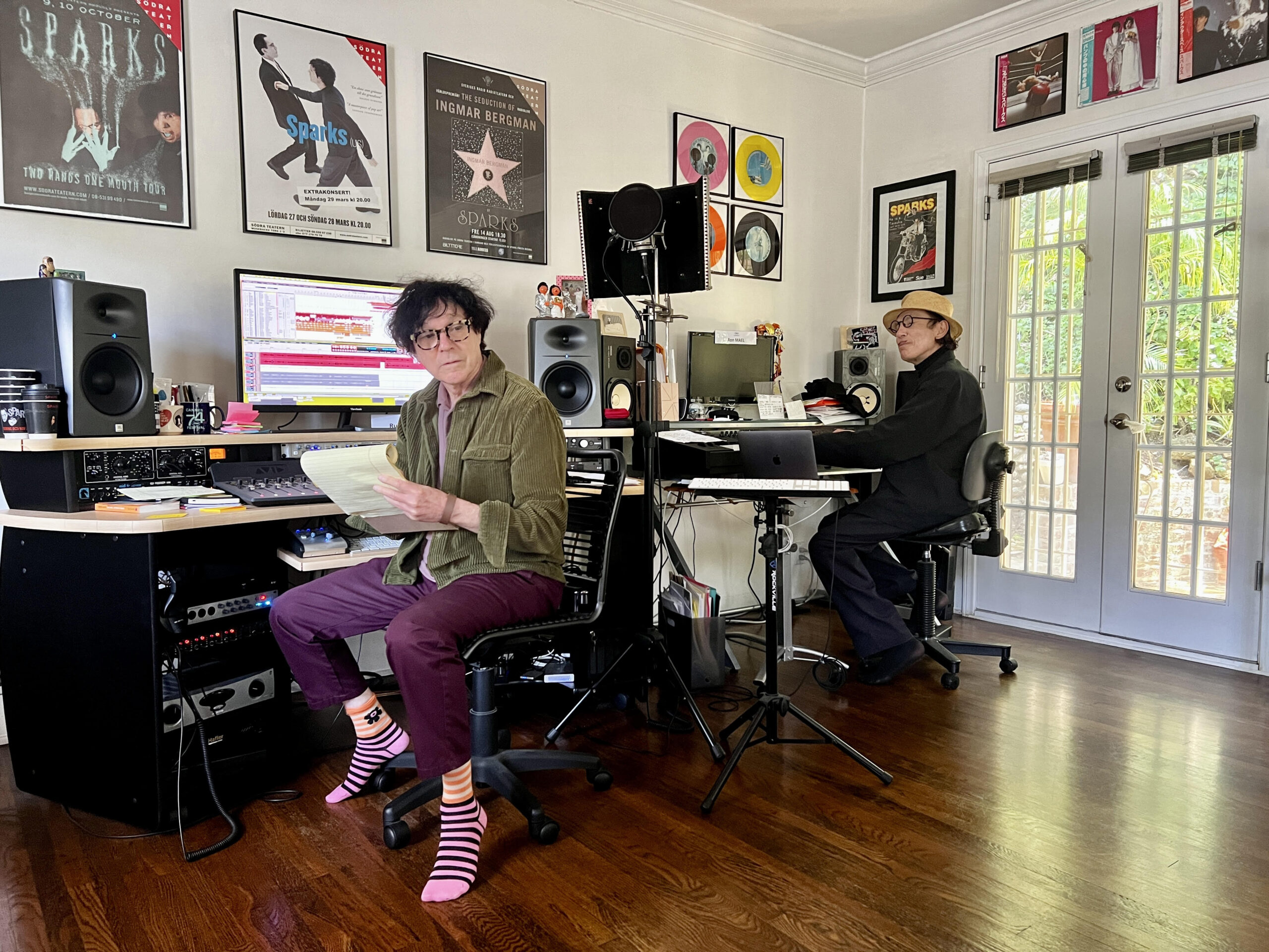 Russell (left) and Ron Mael at work in their private studio, surrounded by memorabilia and gear from JBL Pro, Avid, UA, MOTU, PreSonus and more. Photo: Sparks.