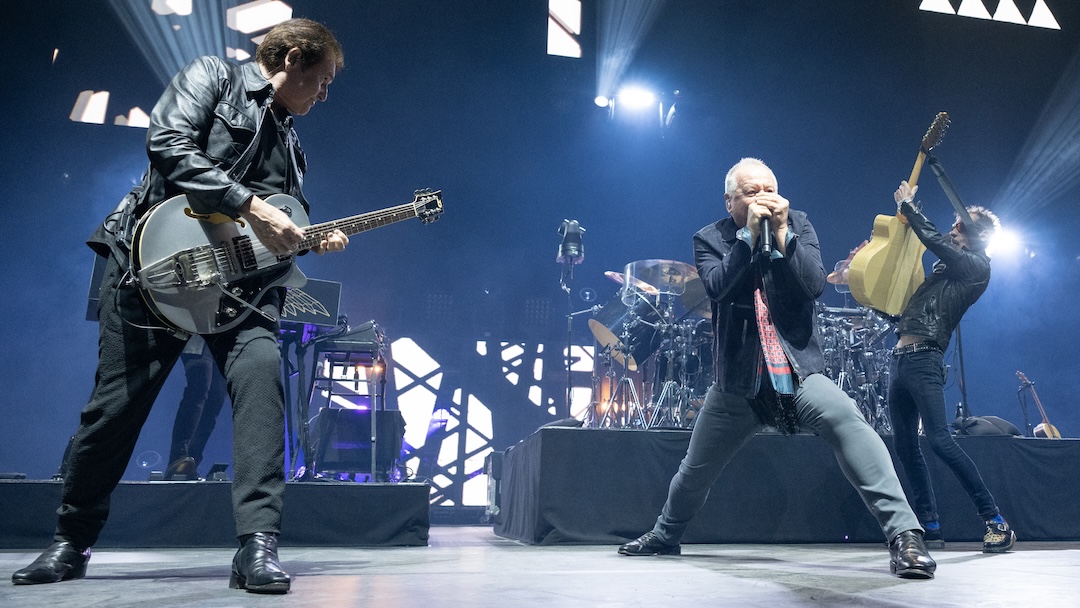Centered around original members Charlie Burchill (left) and Jim Kerr (center), Simple Minds hit the road in North America for 26 shows, including a stop at Denver’s Ball Arena. Photo: Thomas Cooper/Getty Images.