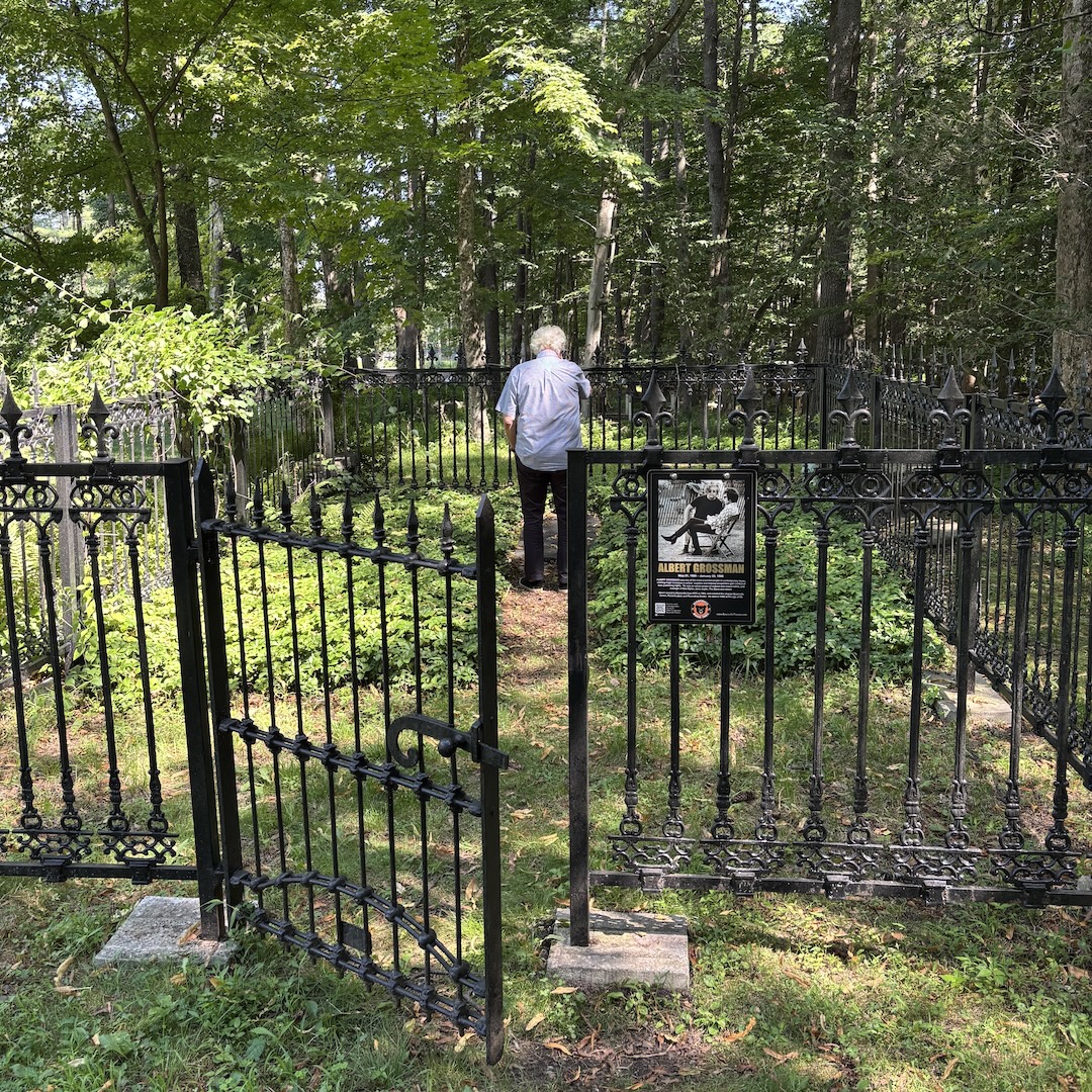 John Storyk, unaware that I’m taking a picture, visits Albert Grossman’s gravesite behind Bearsville Theater for the first time in a decade. He was one of the insiders who arranged for the burial to be held onsite when Grossman passed away in 1986. Photo: Tom Kenny.