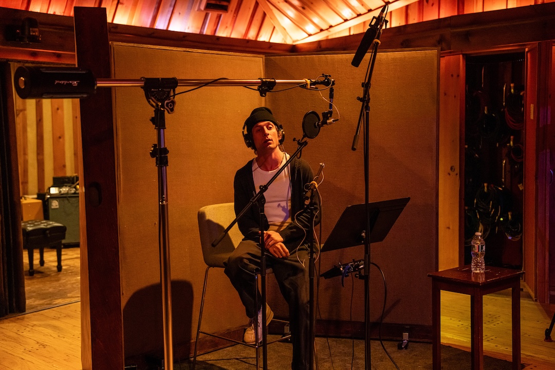 Actor Jeremy Allen White in the vocal booth at Power Station Studio B, for recording of Colts Neck vocal pre-records. Note, besides the Unidyne 545 vocal mic, production sound mixer Tod Maitland’s Sennheiser 416 boom mic, above. Photo: Macall Polay/20th Century Studio