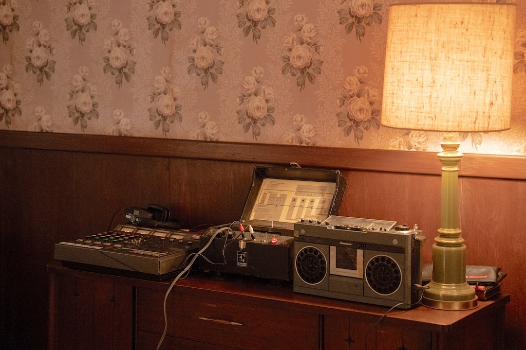 On-set recreation of the mixing setup at Colts Neck: the TEAC 144 4-track Portastudio, an Echoplex Maestro 3, and a 1980 Panasonic RX-5100 boom box. Photo: Macall Polay/20th Century Studio