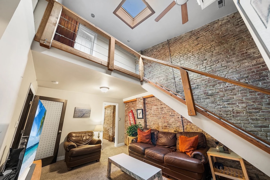 Attached to the studio is a two-story, three-bedroom residence.