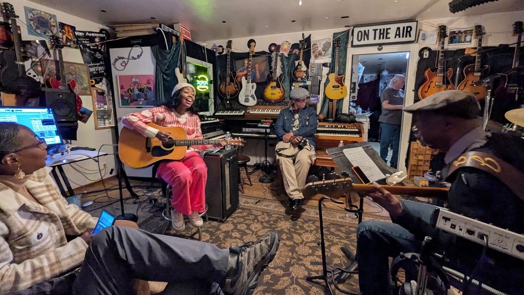 Nia Cephas, on guitar, with friends and musicians at Kid Andersen’s Greaseland Studios, San Jose, Calif. Photo courtesy of Little Village Foundation