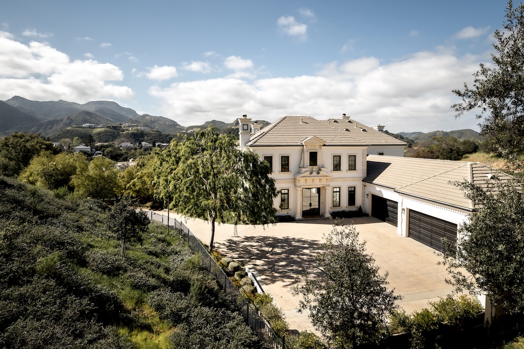 The villa sports a motor court able to fit six cars, in addition to the four-port garage. Photo: Courtesy of Compass/Ginger Glass.