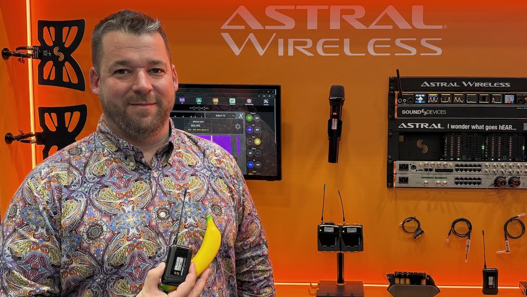 Ben Davenport, marketing manager at Sound Devices, shows off the company’s new Astral Mini Plus compact wireless transmitter—with a banana for scale. The Astral Mini Plus provides 8+ hours battery life, extended 169-1525 MHz tuning range, IP67 water resistance and more.