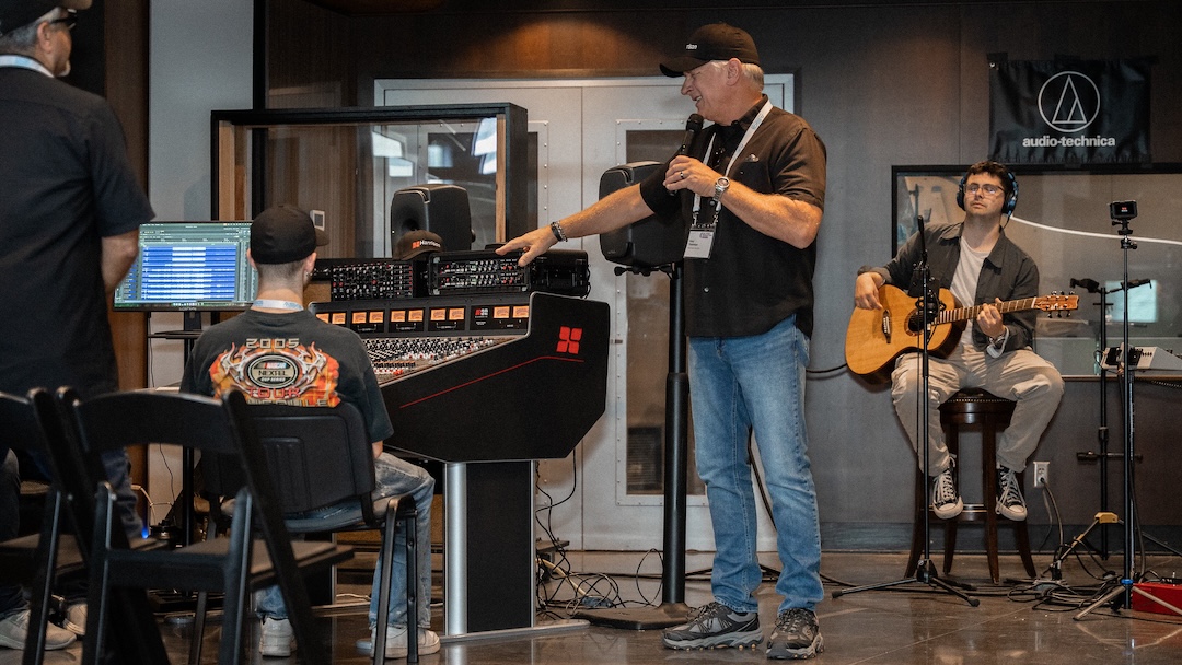 Gary Thielman, Harrison Audio, runs an attendee through the features of the Harrison 32Classic console during a break from the live tracking sessions. Photo: Future/Kevin Craig