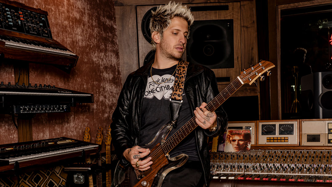 Andrew Watt digs in deep on his vintage Ampeg Dan Armstrong lucite guitar inside his private studio. Photo: Mathieu Bitton. 